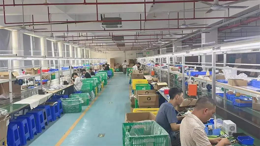 Production line with workers and material trays